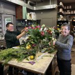 Women putting bouquets together